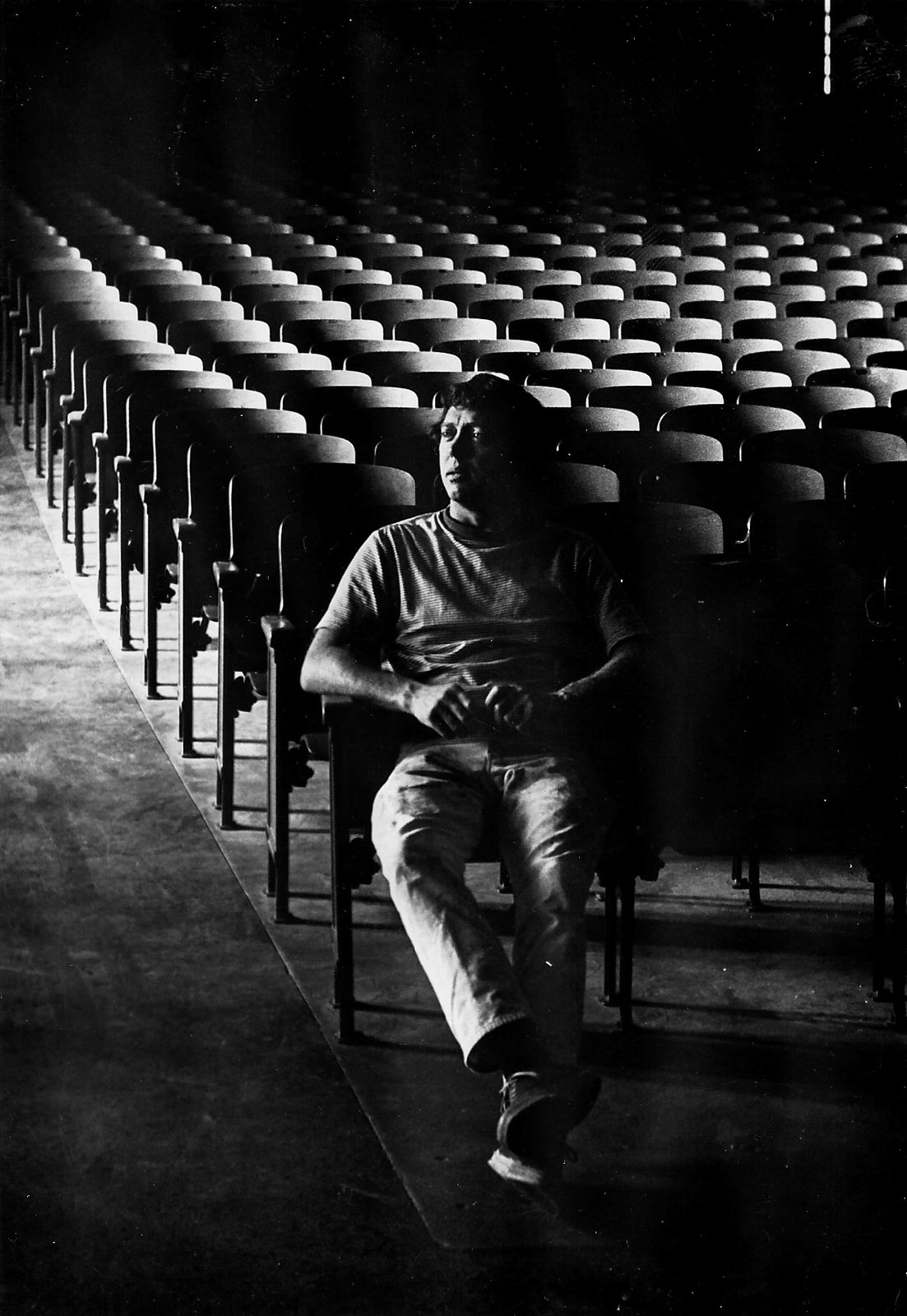 Charles Slater performing on stage in a theatre production